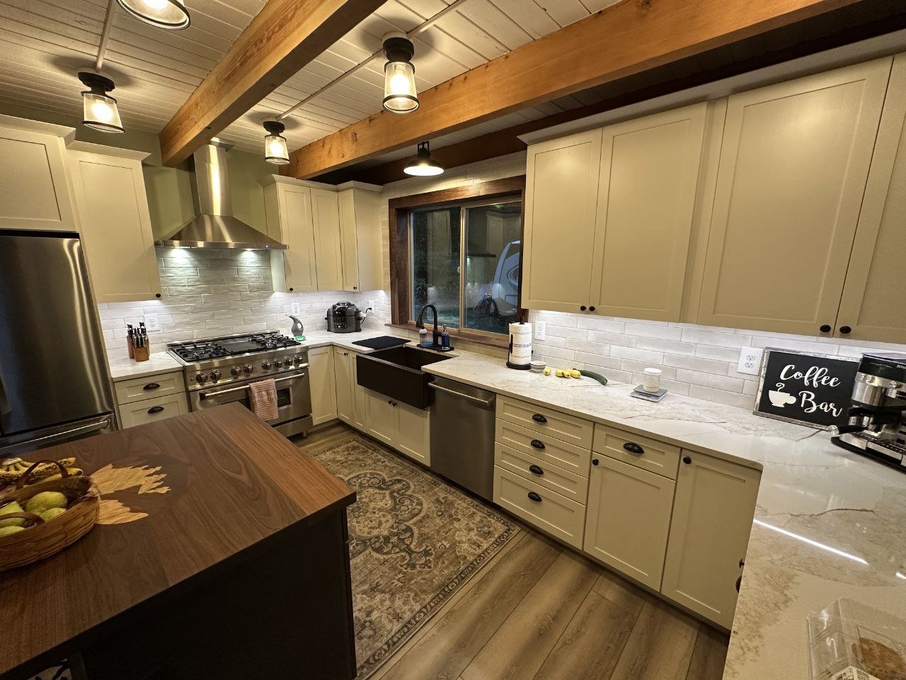 Warm finished kitchen with lighting and electrical details