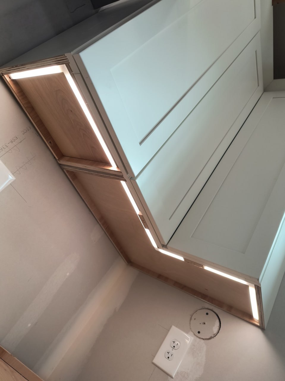 Kitchen with cabinet lighting and a nearby receptacle